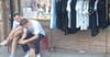 Unattended Boyfriends Bond Over Memes While Placed Outside Female Fashion Outlet