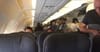 Entire Plane Avoiding Eye Contact During Awkward Standing Part After Seat Belt Light