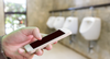 Bloke At Urinal Gets In A Good Ten Second iPhone Scroll