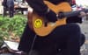 Busker With Smile Sticker On Guitar Probably Opened For John Butler Trio At Some Point
