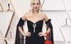 Margot Goes Full Goldie With 4 Pack Of Double Blacks Stashed In Bag For Oscars Ceremony