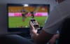 After 67 Days, Man Can Finally Go Back To Playing On Phone With Footy As Background Noise