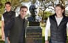 Group Of Young Blokes In Black Puffer Vests Stand Guard At John Howard’s Statue