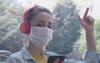 Face Masks Allow Woman To Lip Sync To Kanye On Public Transport