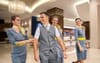 Chirpy Airline Crew Playfully Check Out Of Hotel Lobby Like They Had An Orgy Last Night
