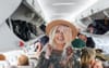 Report: Suffering Plane Trip With Stiff Wide Brim Worth It For The Photos