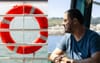 Unused Life Ring On The Ferry Sends Local Office Worker Into Heroic Daydream