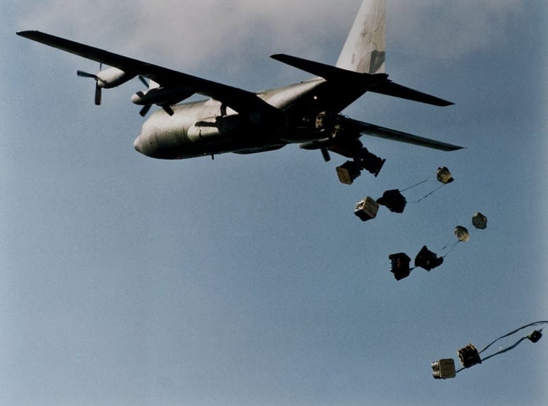 A RAAF C130 dropping bananas to those recovering from the Colombian Flu in Dover Heights. 