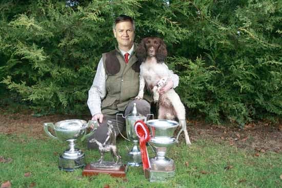 "It's a passion of mine" Bolt pictured with his award-winning spaniel bitch, Peta. SOURCE: Fairfax Media.