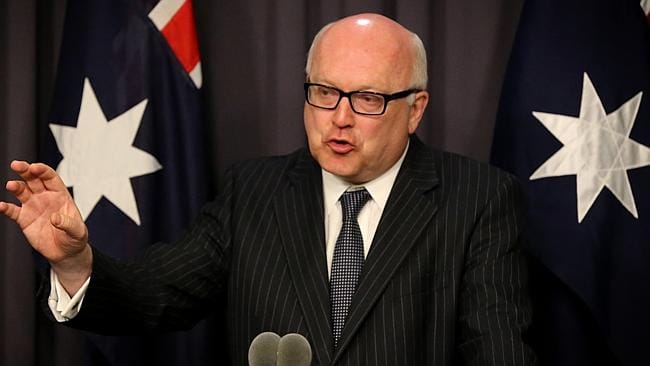 Attorney-General George Brandis QC revealed plans to introduce alcohol plain packaging. PHOTO: Leisa Cantwell/AAP/Panos