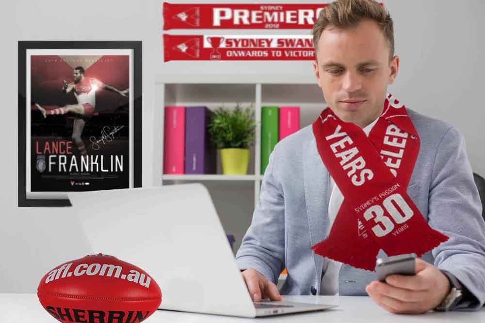 Peter Codey fits out his office with Sydney Swans merchandise, in what co-workers can only describe as an attempt to impress out of state employers.