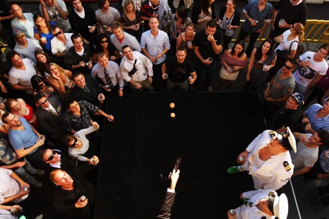 Punters try their luck in a game of two-up following the Anzac Day Dawn service and march.