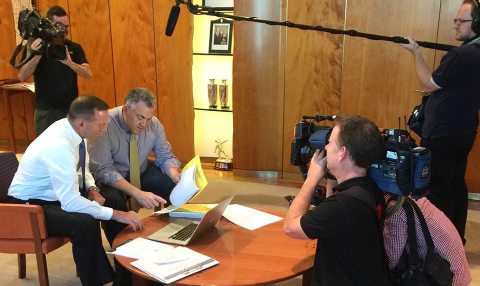 Treasurer Joe Hockey and Prime Minister Tony Abbott reveal the governments new trial program in front of media representatives this morning