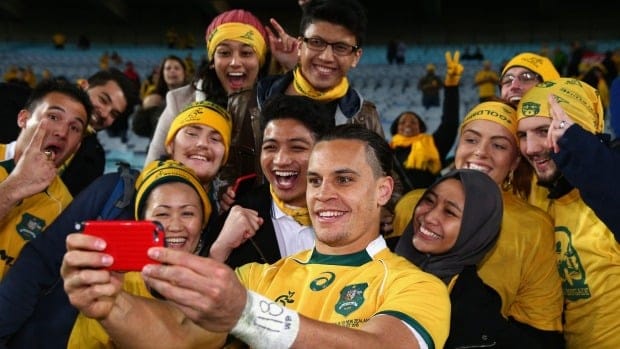 Toomua's fans take the chance to get a selfie with him, despite his haircut