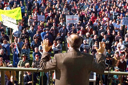 Prime Minister John Howard introduces new gun control while wearing a bullet proof vest. A very bold play that left the Australian gun lobby looking like deranged hillbillies