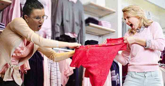 A screenshot from a bystanders video show Ms Lambie in a physical confrontation over a pink blouse