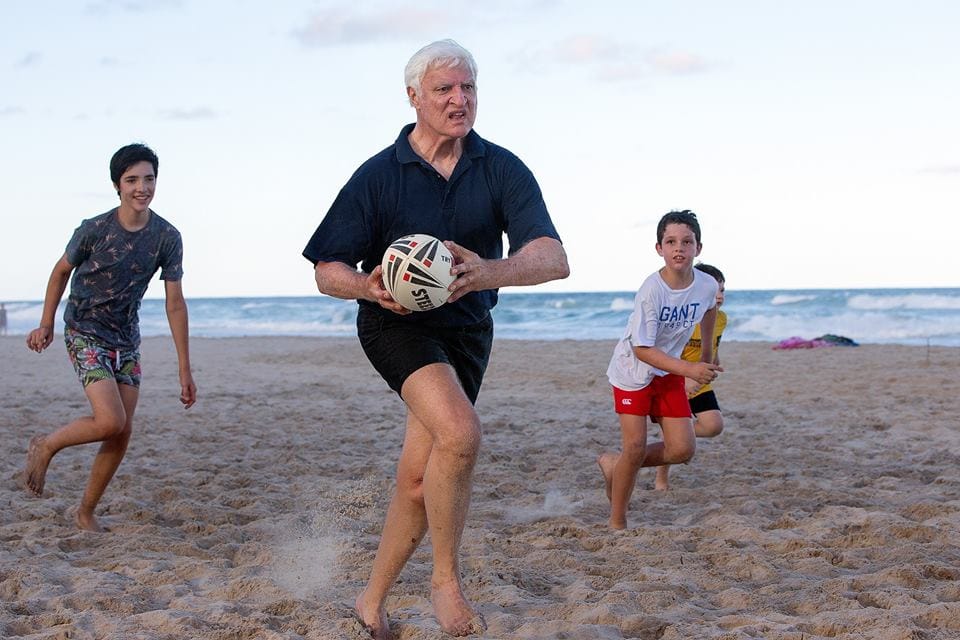 Federal Politician Bob Katter absolutely dominating his grandsons in a beach rugby league match